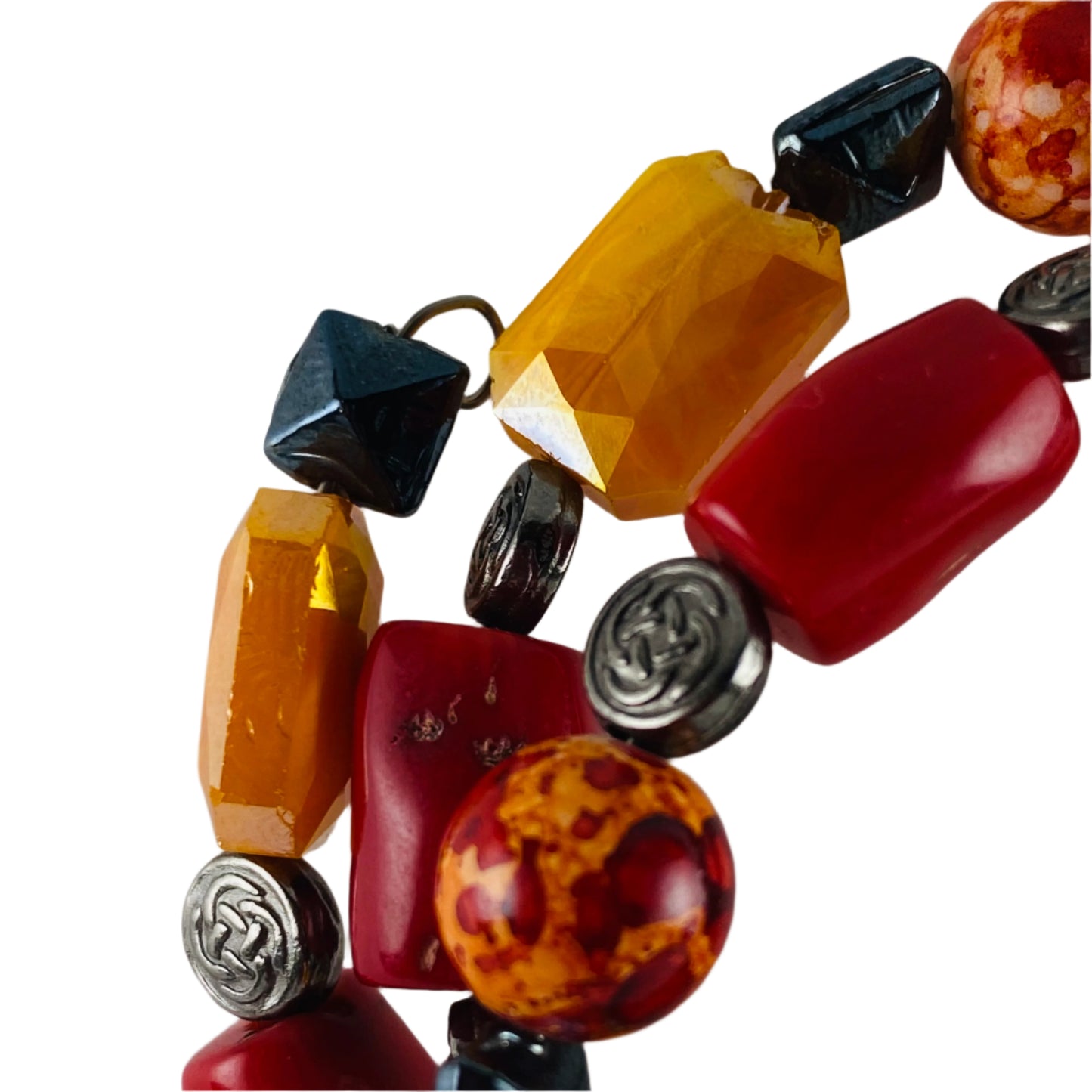 Bracelet with orange, red glass beads accented with gunmetal colored metal beads.  Strung on memory wire.